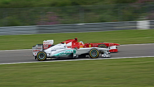 two white and red formula 1's thumbnail