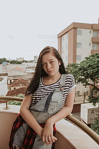 woman leaning on wall thumbnail