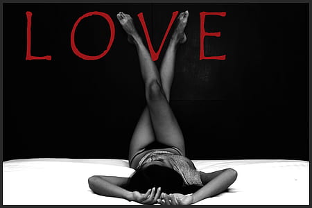 woman lying on bed showing Love text on wall thumbnail