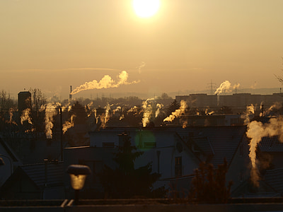 buildings with smokes at golden hour thumbnail