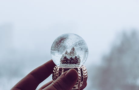 person holding house snow globe thumbnail