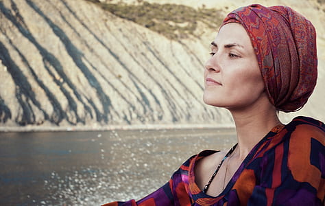 woman wearing red and maroon headdress thumbnail
