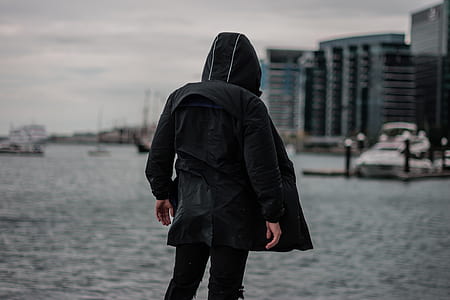 person standing near body of water thumbnail