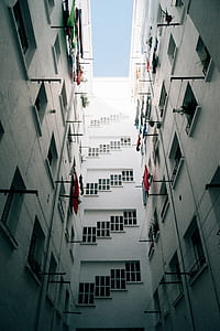 low angle photography of white apartment building at daytime thumbnail