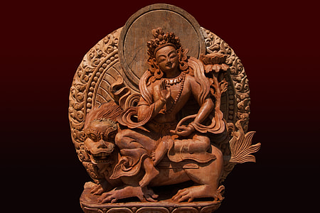 wooden carved woman on animal figurine thumbnail