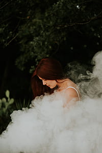 woman in white shirt with smoke thumbnail