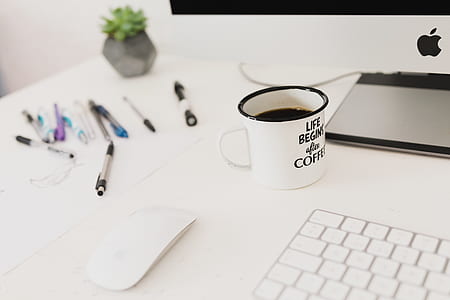 white ceramic mug on table thumbnail