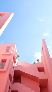 pink concrete house photography under the blue sky thumbnail