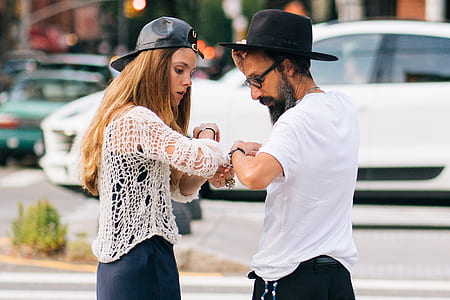 man and woman facing each other while standing thumbnail