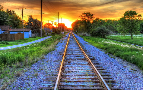 train rail beside grasses thumbnail