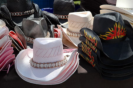 assorted-color cowboy hats on black textile thumbnail