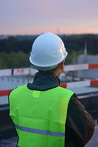 man in green high-visibility vest with white hard hat thumbnail