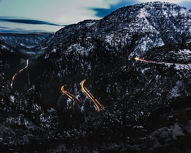 high-angle photography of road leading to peak of mountain thumbnail