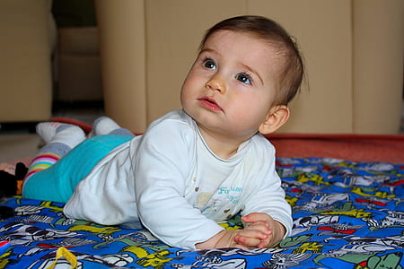 baby on blue sleeping pad thumbnail