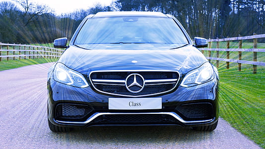 black Mercedes-Benz car beside fence thumbnail
