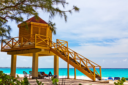 person laying on blue beach chair thumbnail