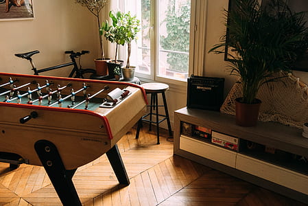 foosball table near sideboard thumbnail