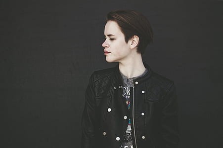 woman in black jacket looking right side thumbnail