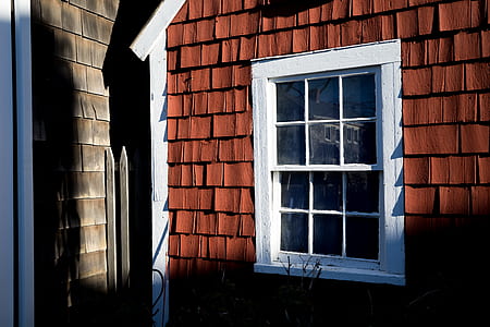 white and red painted house thumbnail