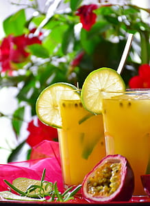two glasses on passion fruit juice with lime slics thumbnail
