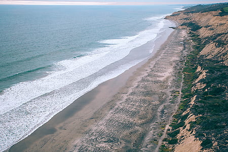 aerial photography of seashore during daytime thumbnail