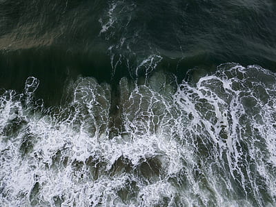 body of water with calm waves at daytime thumbnail