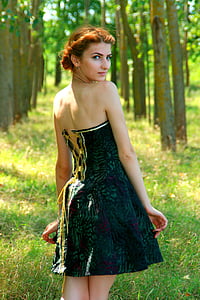 woman wearing green and black strapless dress thumbnail