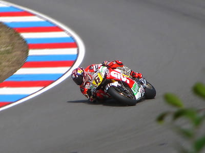 panning photo of sport bike racer on track thumbnail