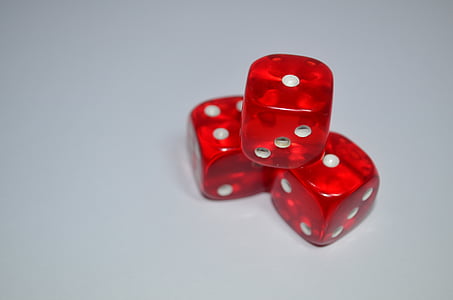 three red-and-white dices on white surface thumbnail
