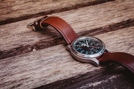 round silver-colored watch displaying 12:07 thumbnail