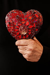 person holding red heart decor thumbnail