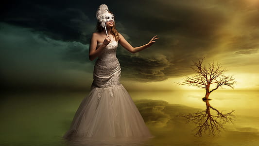 woman in white trumpet dress standing away from bale tree thumbnail
