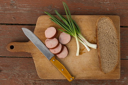 celery placed near bread and knife on to of chopping board thumbnail