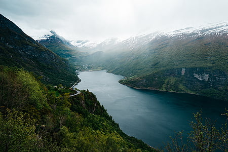 aerial photo of calm large body of water between mountains thumbnail
