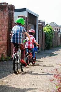 two children riding the bike thumbnail