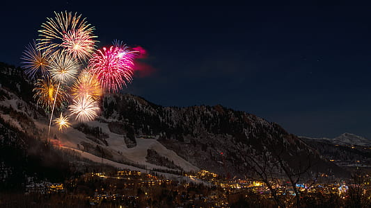 aerial view photography of fireworks near mountain thumbnail