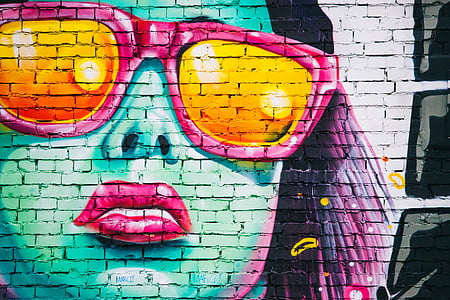 woman wearing sunglasses mural on brick wall thumbnail