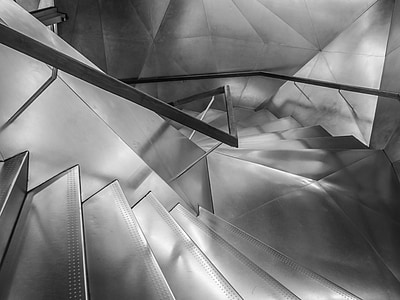 shallow focus photography of gray spiral staircase thumbnail