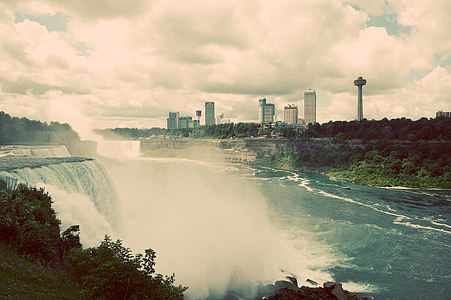 waterfalls near city during datyime thumbnail