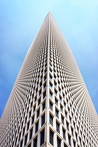 low angle photo of beige high-rise building thumbnail
