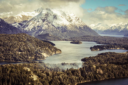 lake with mountain range view during daytime thumbnail