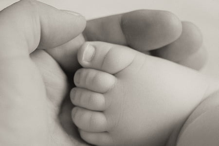 person holding baby's foot thumbnail