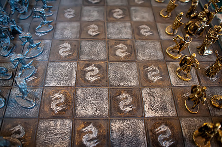 chess board with gold and silver chess piece set thumbnail