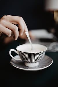 Male working with a laptop and a cup of coffee thumbnail