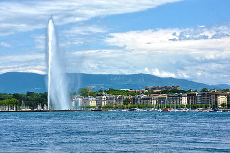 water fountain surrounded with buildings thumbnail