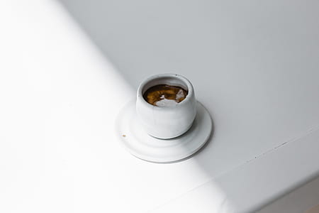 top view photography of mug filled with brown beverage thumbnail