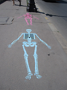 two pink and blue skeleton artwork on gray pavement thumbnail