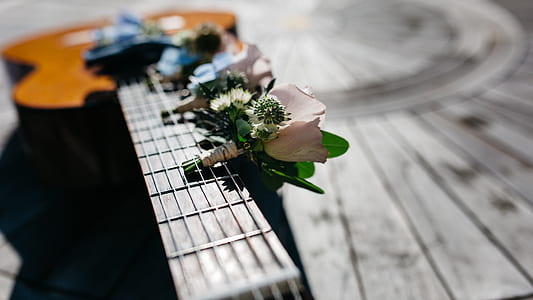 selective focus photo of pink boutonniere thumbnail