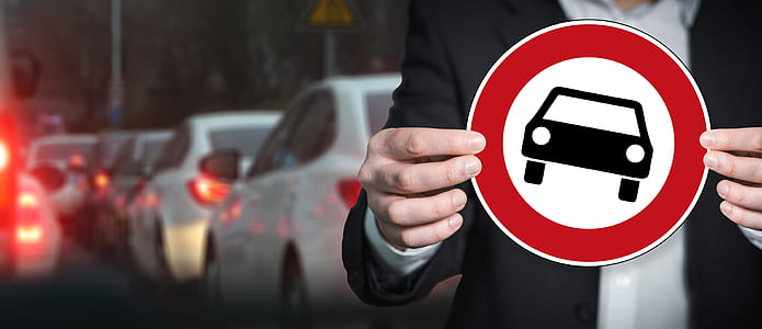 selective focus photography of white vehicles on road thumbnail