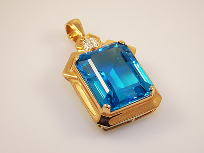 gold-colored blue gemstone stud pendant thumbnail